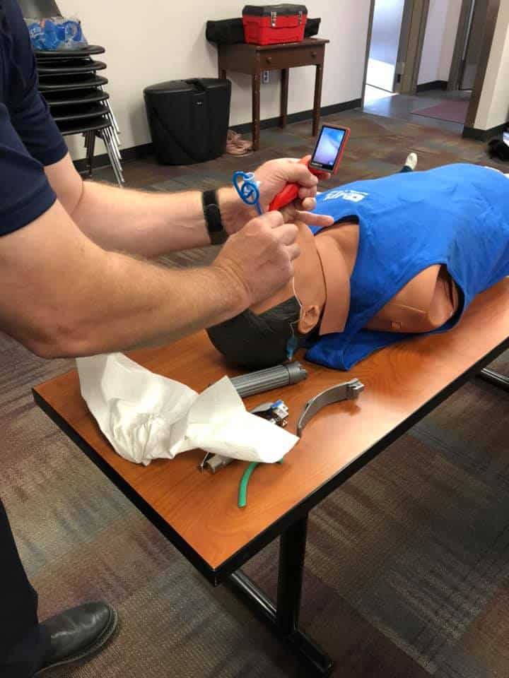 EMS volunteers train on airway procedures.