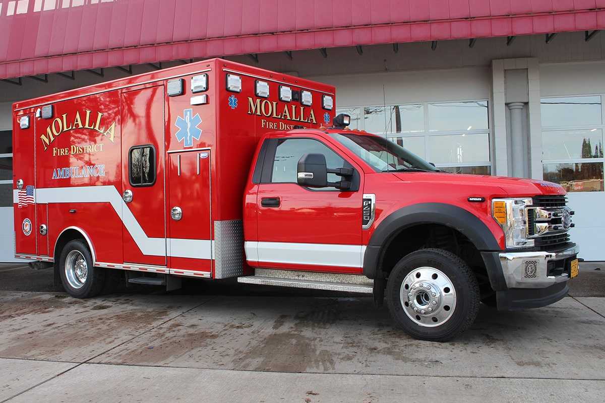 Medic unit 384 parked in front of the bay doors