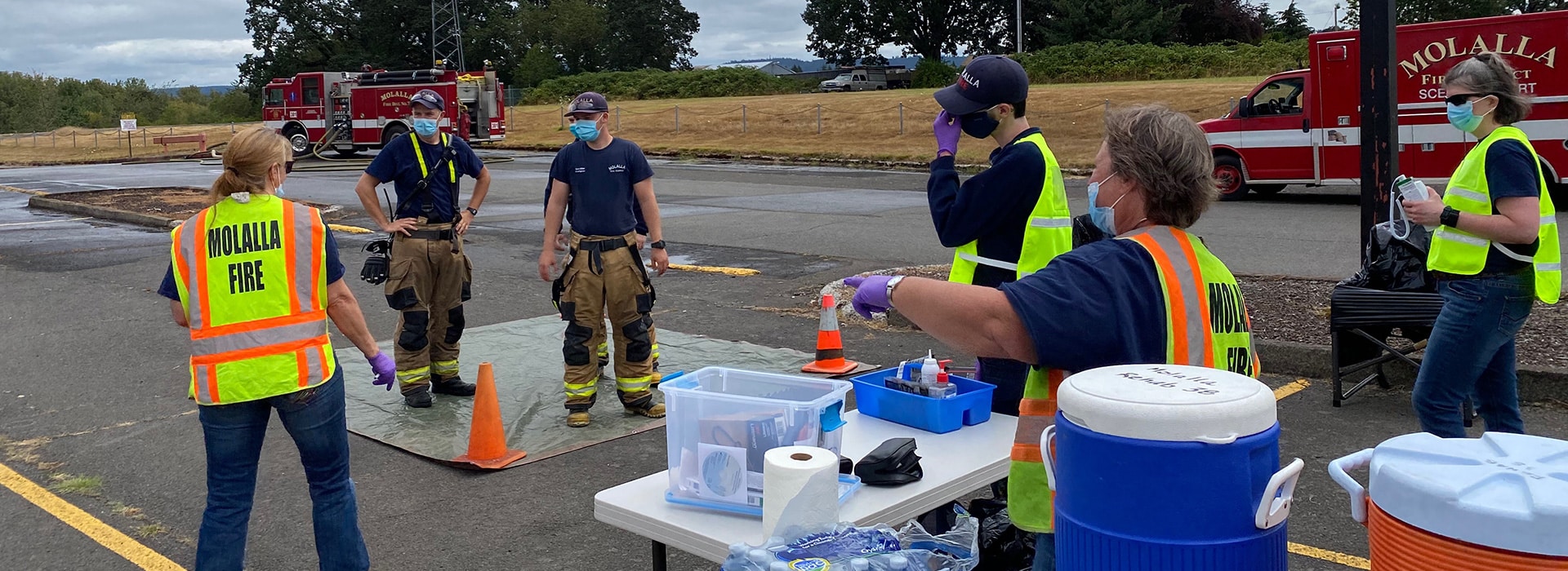 Molalla support volunteers assisting with decontamination training